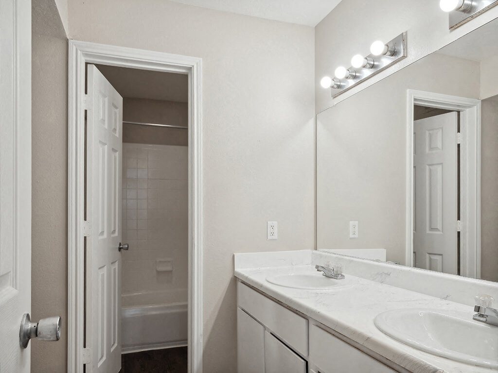Bathroom with closet at Park Village Apartments in Conroe TX